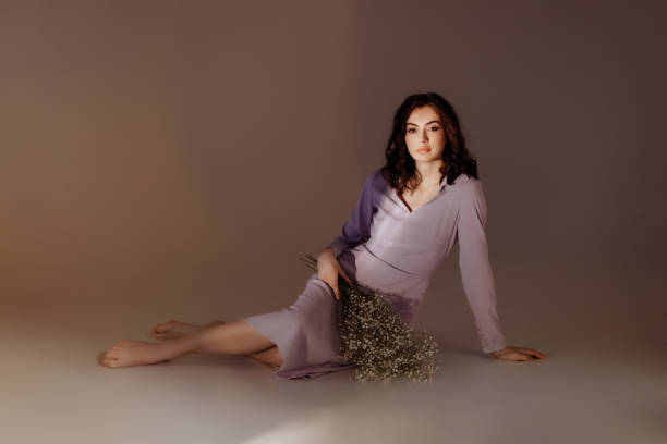 istock Attractive woman with bouquet on abstract background 1490663549