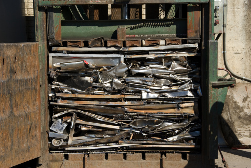 A baler compacting scrap metal
