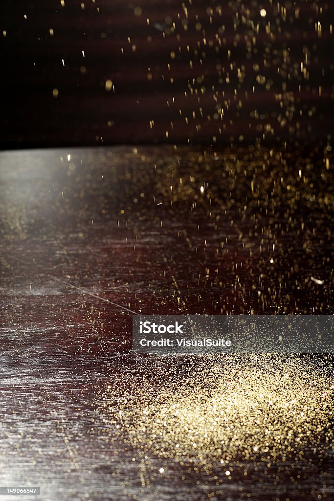 golden rain gold dust falling Beauty Product Stock Photo