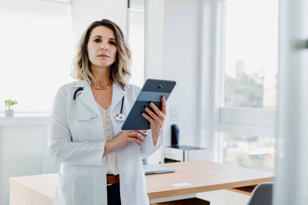 istock Portrait of female doctor using digital tablet 1490665584