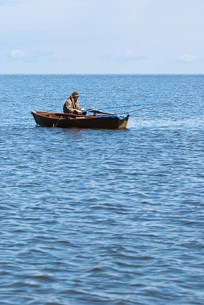 istock fisher in a boat at Baikal 149066573