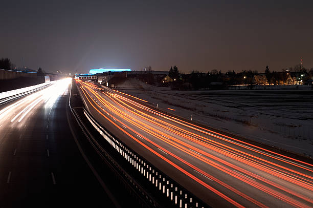 Night scene of Allianz Arena and highway traffic