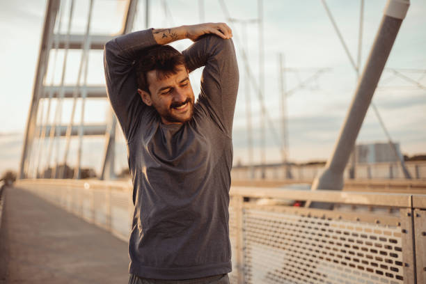istock Sportsman Warming Up Before Starting His Exercise 1490666546