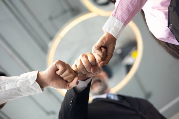 istock Business teamwork. Employee team hands together. Unity and teamwork concept. 1490667313