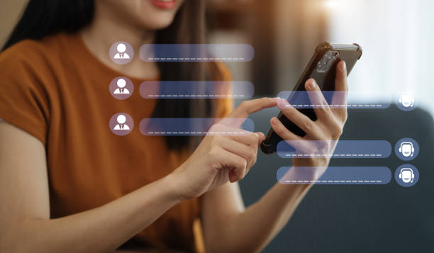 istock Woman online chatting with AI chat bot on smartphone. Artificial intelligence robot innovation technology communicate and answer questions with smart conversation and provide creative solution ideas. 1490668729