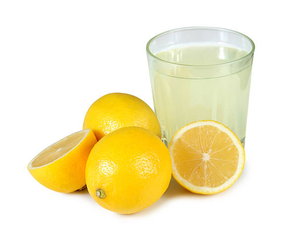 Freshly squeezed glass of lemon juice. stock photo