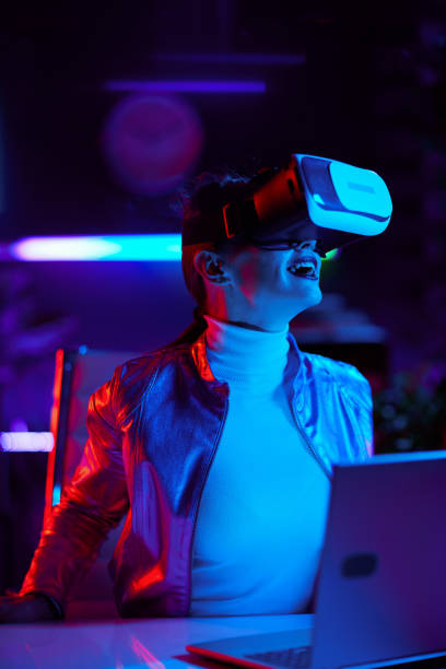 istock excited woman in virtual reality goggles in office 1490669436