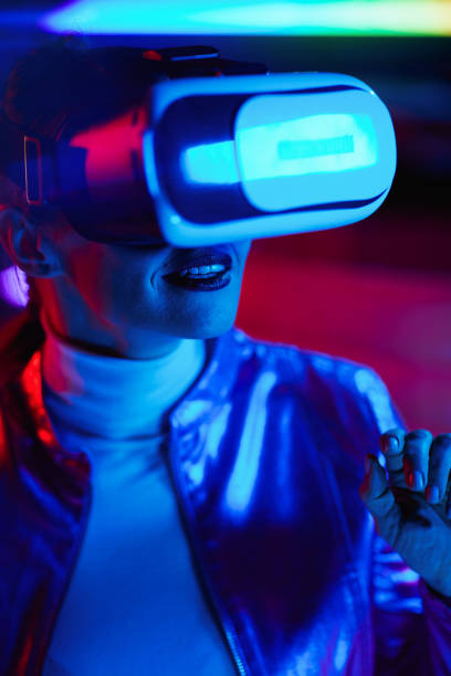istock happy elegant woman in virtual reality goggles in office 1490669496