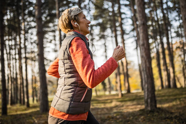 istock Mature woman running in nature 1490671158