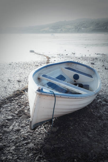 istock Rowing gigs moored on Shaldon beach in Devon at low tide. 1490672961