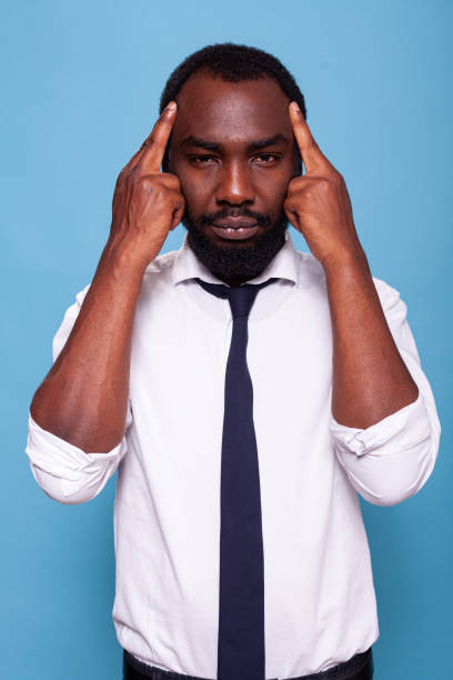 istock Tired office worker feeling tension pressing temples with index fingers 1490673541