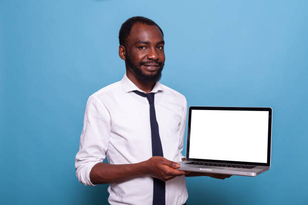 istock Smiling african american entrepreneur presenting laptop with white screen 1490674711