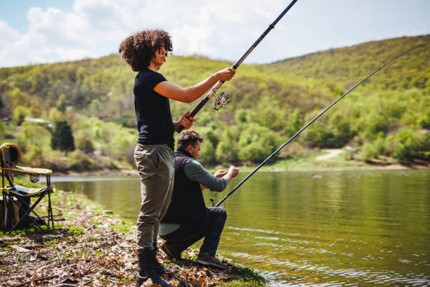 istock Teenage boy learning fishing 1490674768
