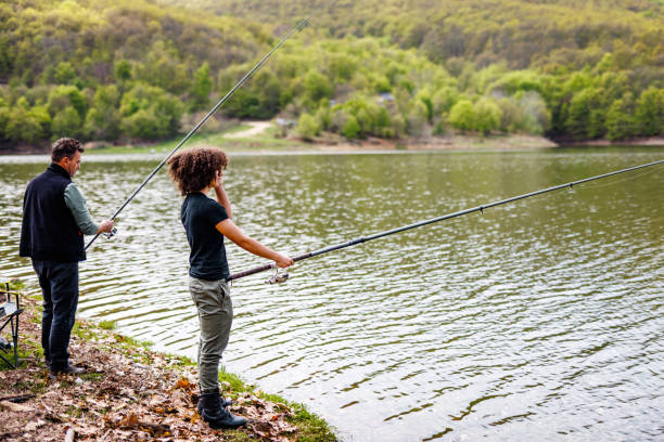 istock Family fishermans catches a fish 1490675062