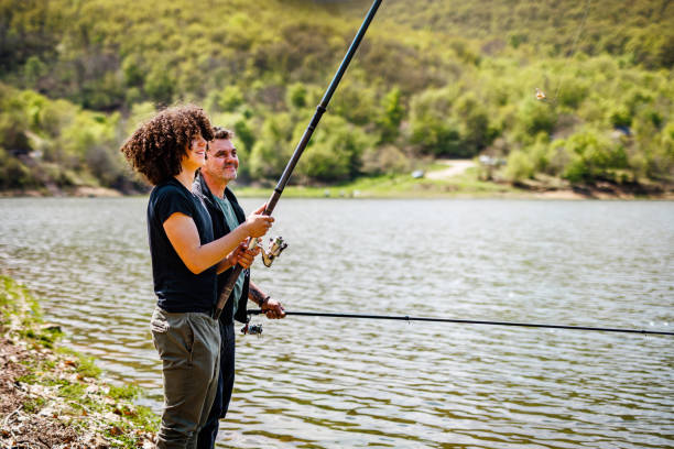 istock Happy father and son fishing 1490675140