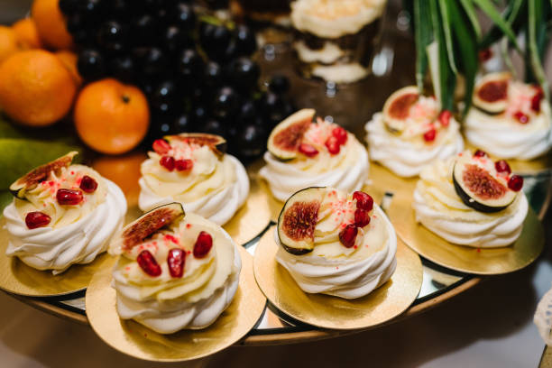 istock Candy bar. Sweet table for celebration. Cakes with fruit on a festive table in a restaurant. Closeup details. 1490675204