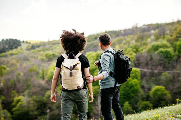 istock Man showing son beauty in nature 1490675294