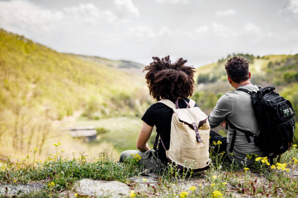 istock Father and son with backpacks enjoys view in the mountains 1490675427