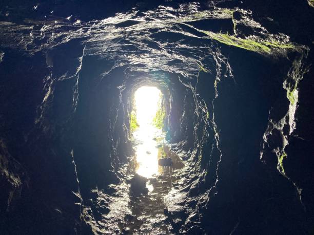 istock Inside an old mine tunnel looking along the passage towards the entrance 1490675592