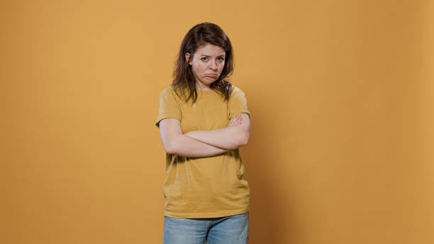 istock Seriously upset woman with arms crossed feeling sad and disappointed looking grumpy mumbling 1490676621