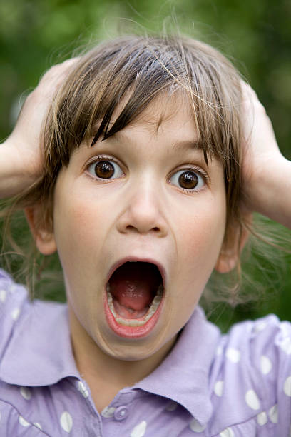 istock screaming and astinished young girl 149067889