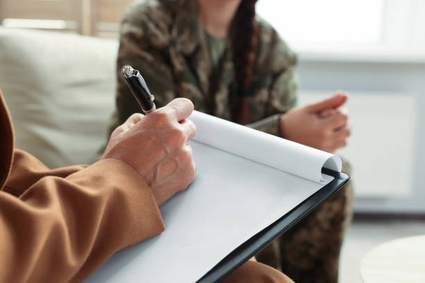 istock Psychologist working with military officer in office, focus on hand 1490683089