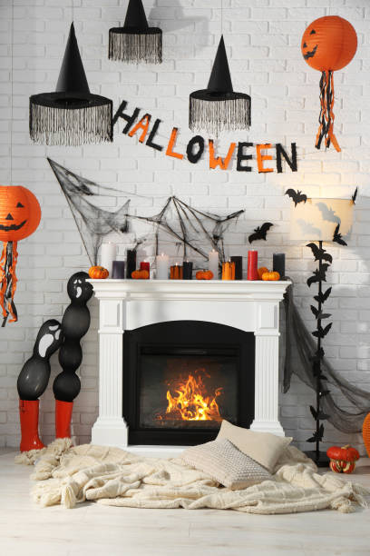 Room with fireplace decorated for Halloween. Festive interior