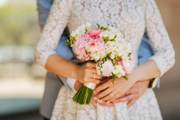 istock Bride and groom's hands close up photo. 1490683237