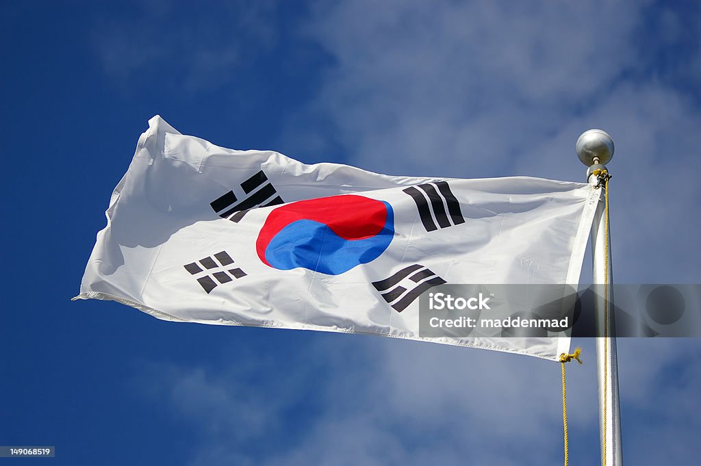 south korean flag south korean flag against cloudy sky Asia Stock Photo