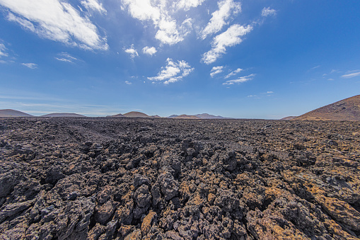 Panoramic view over the barren volcanic Timanfaya National Park on Lanzarote during daytime