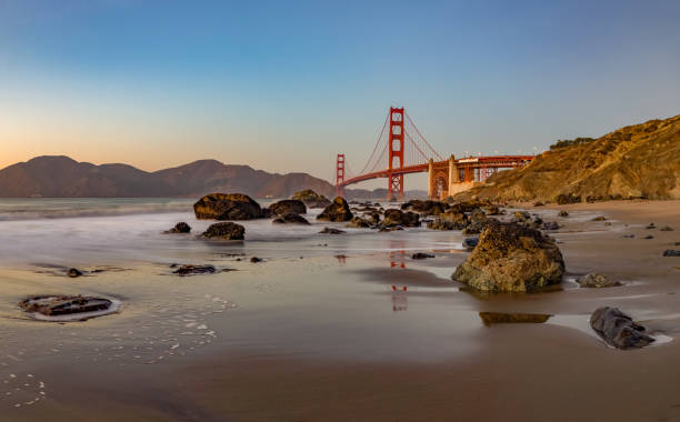 istock Golden Gate Bridge and Baker Beach Rocks at Sunset 1490688079