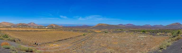 Panoramic view over the barren volcanic Timanfaya National Park on Lanzarote during daytime