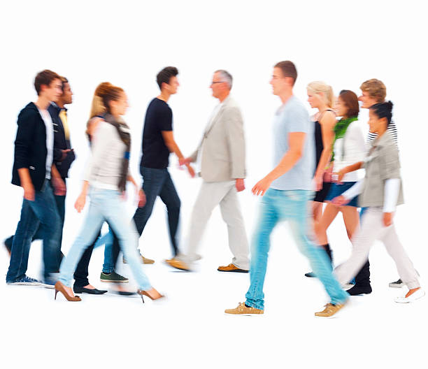 grupo de personas caminando contra fondo blanco - blurred motion motion group of people crowded fotografías e imágenes de stock