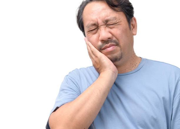 istock Handsome middle age senior man touching mouth with hand with painful expression because of toothache 1490692138