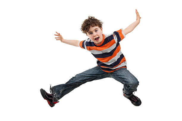 istock Curly Haired boy in jeans and t shirt jumping 149069287
