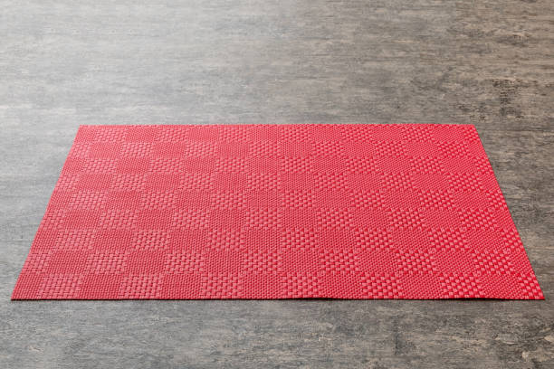 istock Perspective view of red tablecloth for food on cement background. Empty space for your design 1490694274