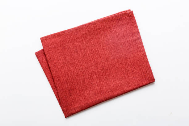 istock top view with red empty kitchen napkin isolated on table background. Folded cloth for mockup with copy space, Flat lay. Minimal style 1490694417