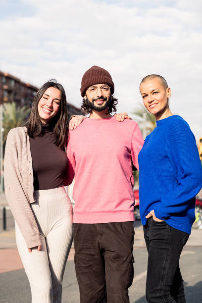 istock three joyful best friends smiling together 1490696619
