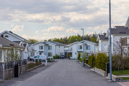 Beautiful view of modern European suburb with wooden white villas. New modern houses. Sweden.