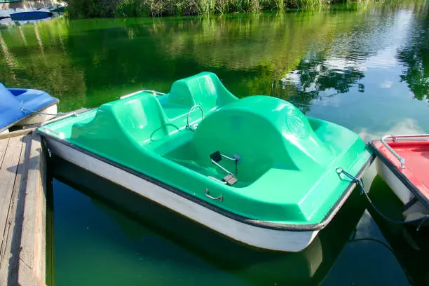 Colorful pedal boats docked at the Stow Lake boathouse