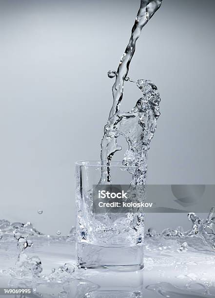 Glass Of Pouring Water Stock Photo - Download Image Now - Cup, Drinking Glass, Glass - Material