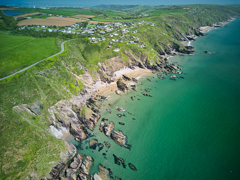 Whitsand Bay, situated in south east Cornwall, England, runs from Rame Head in the east to Portwrinkle in the west. It is characterised by sheer, high cliffs, dramatic scenery and long stretches of sandy beaches.
