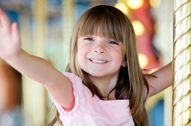 istock Little girl on carousel 149070068