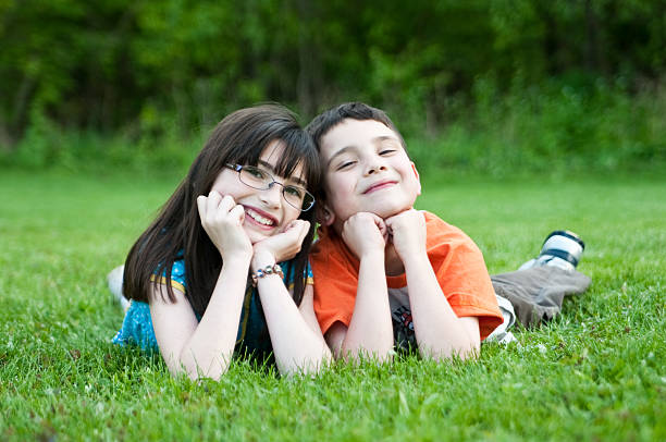 istock Kids laying in the grass. 149070225