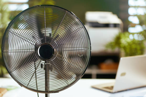 istock electric fan in modern green office 1490703514