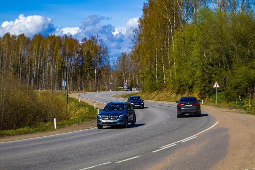 Russia, St. Petersburg - May 5, 2023: The movement of cars on a winding road