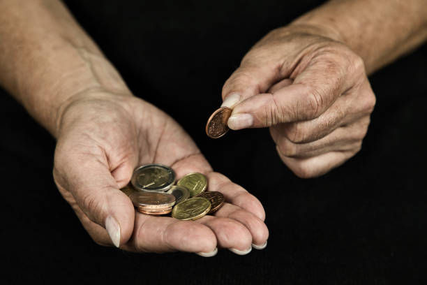 istock Hands with money and coins 1490704971