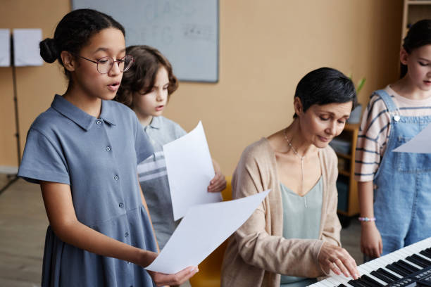istock Choir of children singing songs in class 1490709014