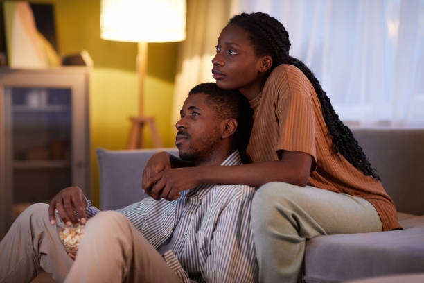 istock Couple enjoying watching movie together 1490709448