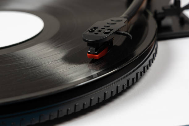 istock Vinyl turntable with vinyl plate. Modern gramophone record player. Retro sound technology to play music 1490710080